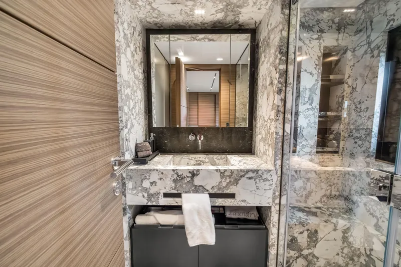 Slide: The Image of Luxurious marble bathroom in 2023 Custom Line NAVETTA 42 yacht, featuring modern sink and mirror. - 39