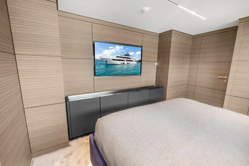 Slide: The Image of Luxurious bedroom interior of 2023 Custom Line NAVETTA 42 yacht with modern design elements. - 43