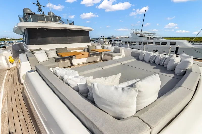 Slide: The Image of Luxurious 2023 Custom Line NAVETTA 42 yacht deck with polished wood and chrome details. - 50