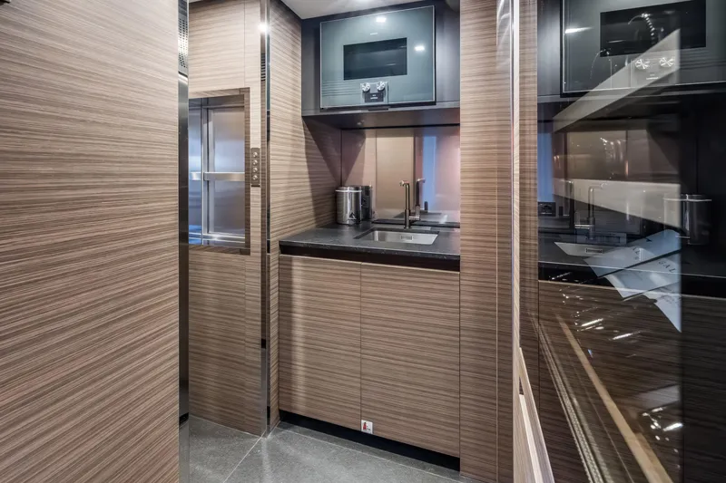 Slide: The Image of Luxurious interior of 2023 Custom Line NAVETTA 42 yacht with elegant furnishings and panoramic views. - 56