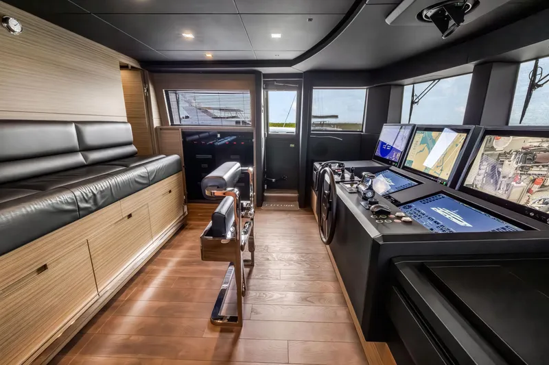 Slide: The Image of Luxurious 2023 Custom Line NAVETTA 42 yacht cockpit with advanced navigation systems. - 66