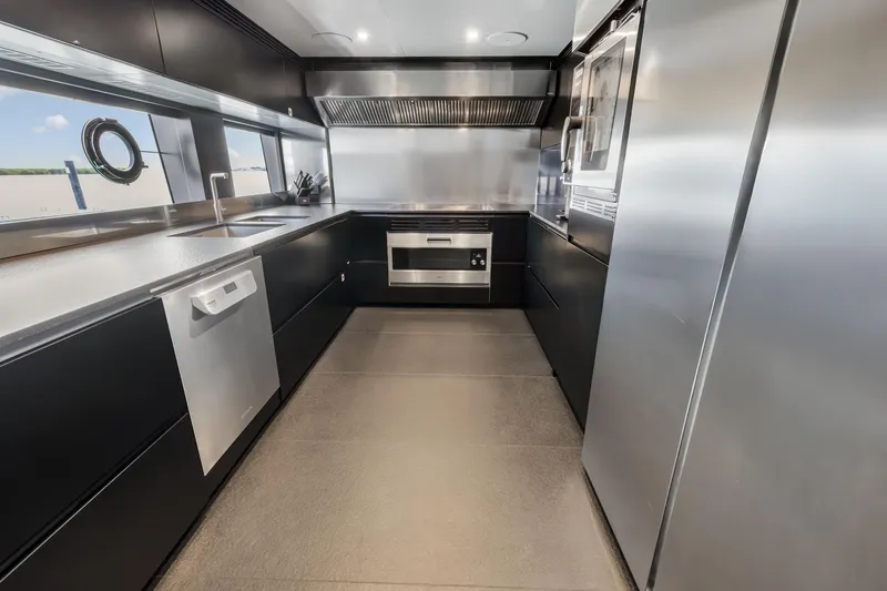 Slide: The Image of Modern helm of 2023 Custom Line NAVETTA 42 yacht with advanced navigation systems. - 71