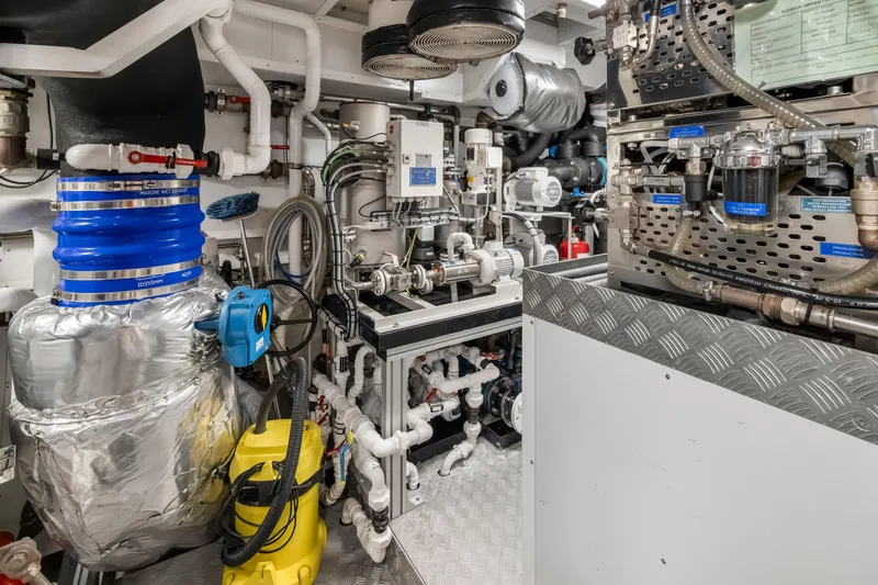 Slide: The Image of Luxury yacht NAVETTA 42, 2023 model, featuring sleek deck controls and ocean backdrop. - 72