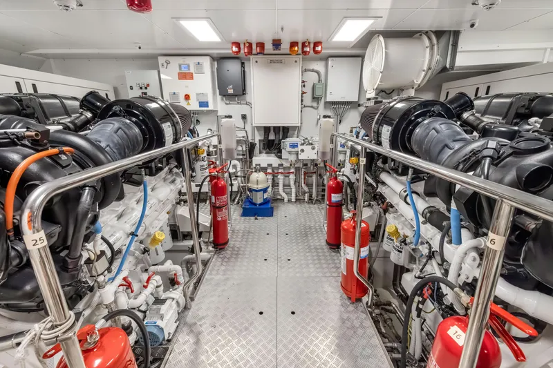 Slide: The Image of Engine room of 2023 Custom Line NAVETTA 42 yacht with control panels and piping. - 76
