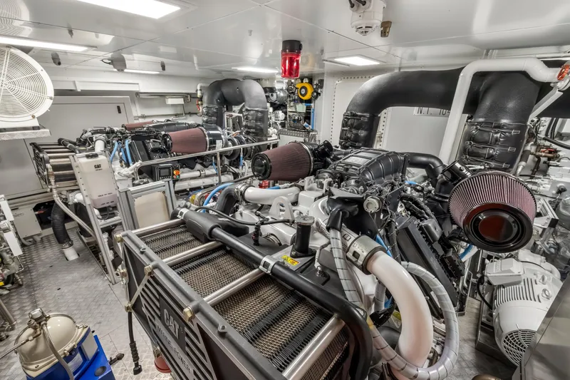 Slide: The Image of Engine room of 2023 Custom Line NAVETTA 42 yacht, featuring advanced machinery and safety equipment. - 78