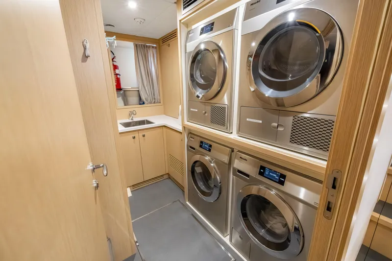 Slide: The Image of Engine room of 2023 Custom Line NAVETTA 42 yacht, featuring advanced machinery and safety equipment. - 79