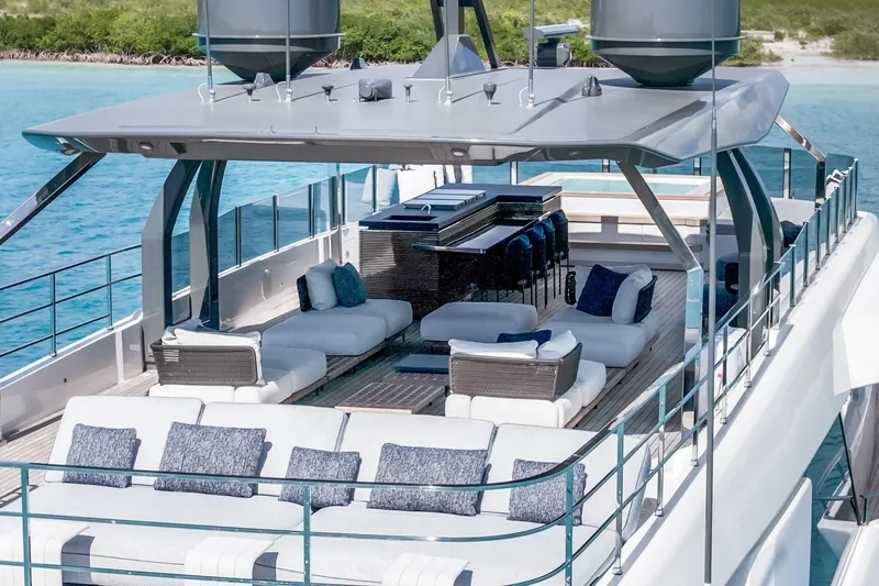 Slide: The Image of Narrow hallway inside 2023 Custom Line NAVETTA 42 yacht, featuring wooden doors and shelving. - 85