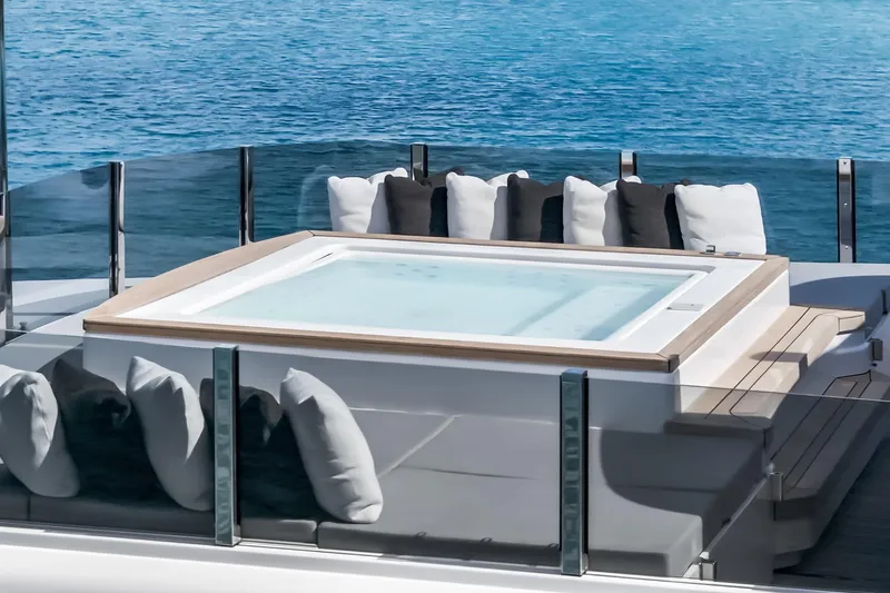 Slide: The Image of Luxurious 2023 Custom Line NAVETTA 42 yacht deck with ocean view and plush seating. - 89