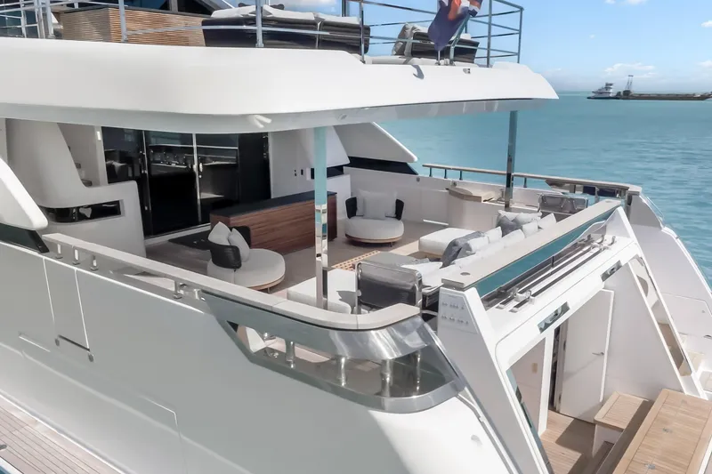 Slide: The Image of Luxury yacht Custom Line NAVETTA 42, 2023 model, with elegant deck and ocean view. - 90