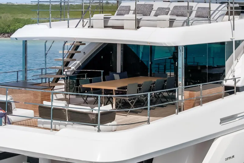 Slide: The Image of Luxurious jacuzzi on 2023 Custom Line NAVETTA 42 yacht, surrounded by ocean views. - 92