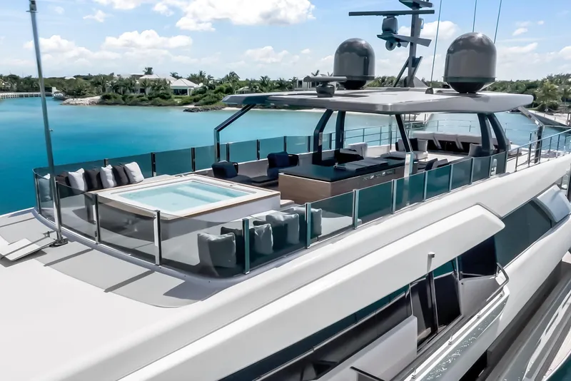 Slide: The Image of Luxurious 2023 Custom Line NAVETTA 42 yacht with jacuzzi, sleek design, and stunning ocean view. - 97