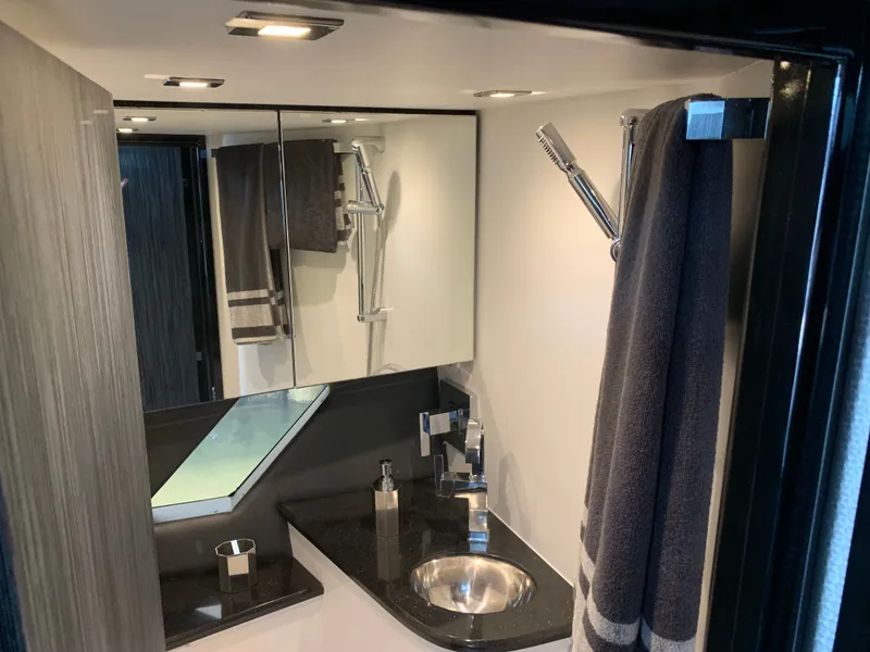 Slide: The Image of Luxurious bathroom in Silverton 4100 SC boat, year 2019. - 10