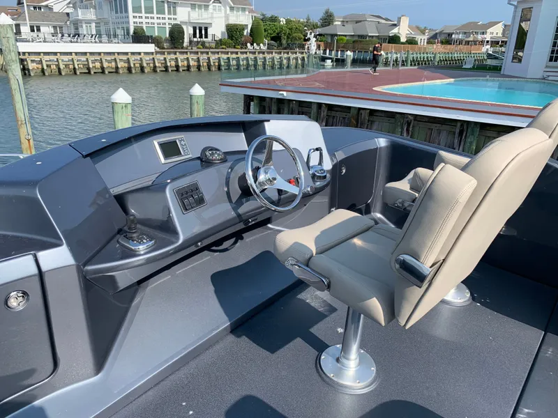 Slide: The Image of Silverton 4100 SC yacht helm, 2019 model, docked by water. - 18