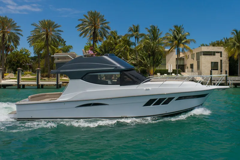 Slide: The Image of 2019 Silverton 4100 SC yacht cruising in tropical waters. - 2