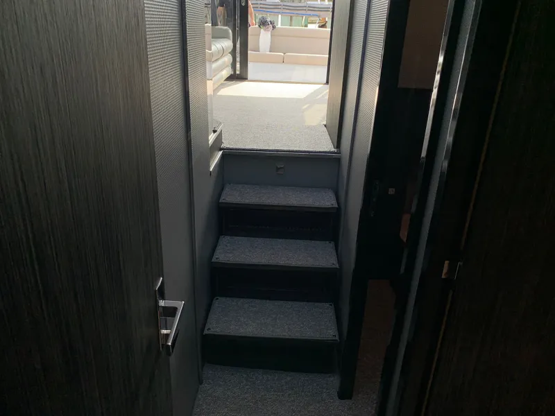 Slide: The Image of Interior of Silverton 4100 SC yacht, stairs leading to deck. - 22