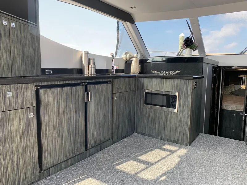 Slide: The Image of Interior of Silverton 4100 SC yacht, modern kitchen, 2019 model. - 24