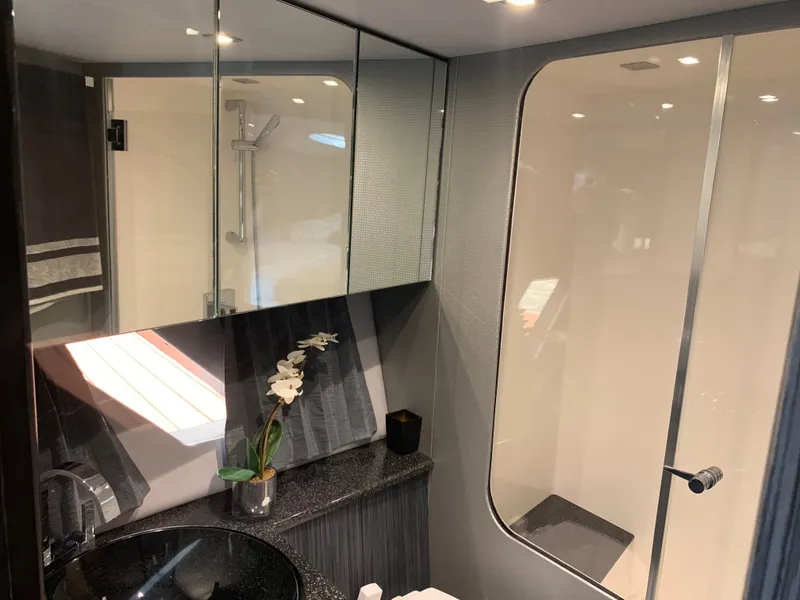 Slide: The Image of Luxurious bathroom on the 2019 Silverton 4100 SC yacht. - 33