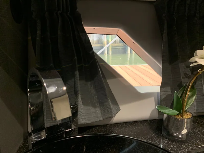 Slide: The Image of Interior of Silverton 4100 SC yacht with window and plant. - 8
