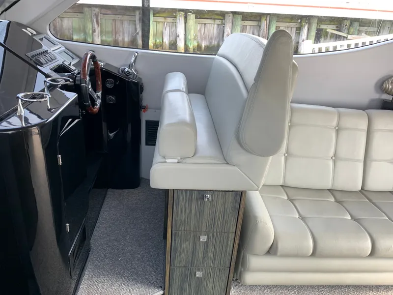 Slide: The Image of Interior of a 2019 Silverton 4100 SC boat with white leather sofa. - 9