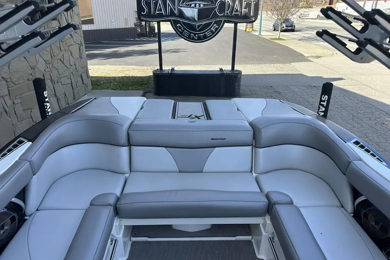 Slide: The Image of 2018 MasterCraft XT22 boat interior with gray and white seating at StanCraft Center. - 5