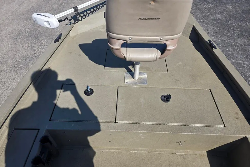 Slide: The Image of 2011 Alumacraft MV 1860 AW SC boat interior with seat and storage compartments. - 12