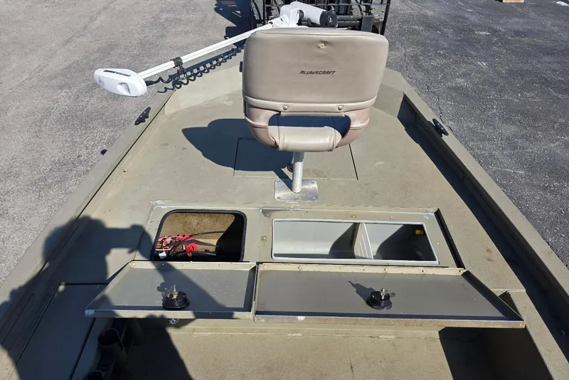 Slide: The Image of 2011 Alumacraft MV 1860 AW SC boat interior with storage compartments and seat. - 13