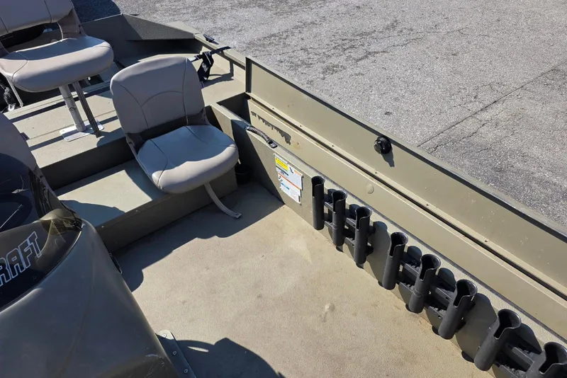 Slide: The Image of 2011 Alumacraft MV 1860 AW SC boat interior with seating and rod holders. - 18