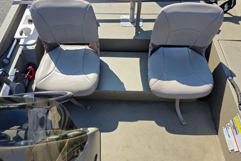 Slide: The Image of 2011 Alumacraft MV 1860 AW SC boat interior with two seats and steering console. - 19