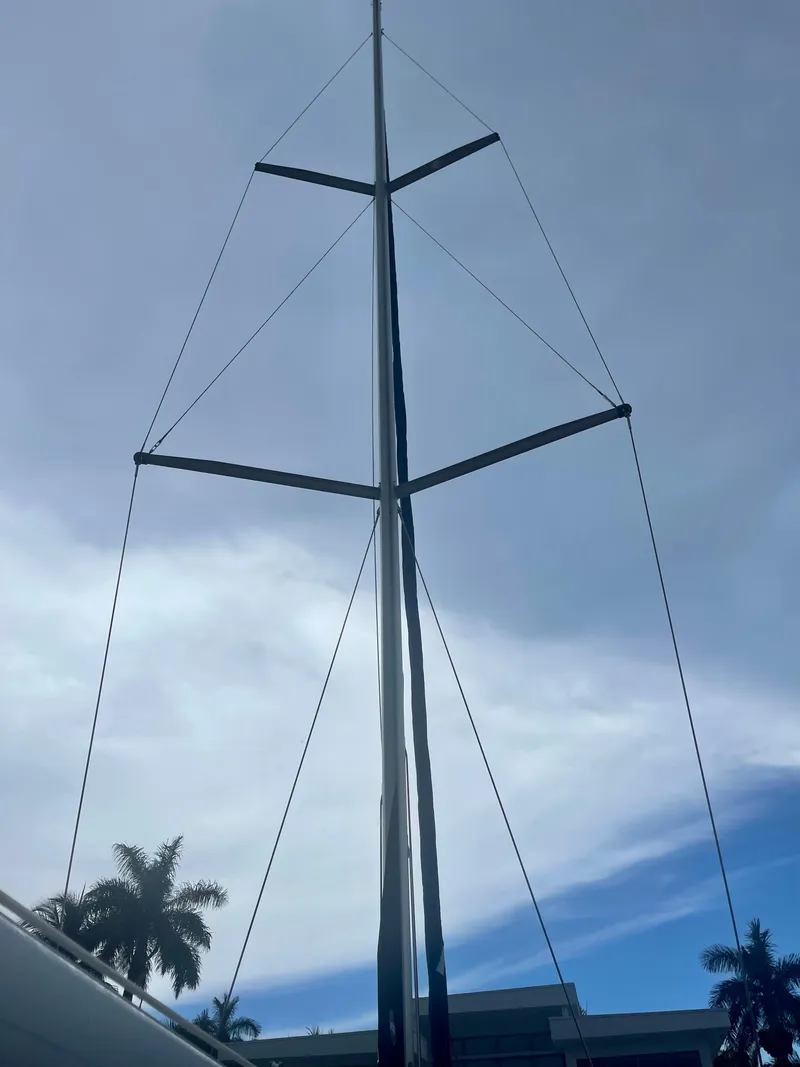 Slide: The Image of Mast of a 2009 Beneteau Oceanis 43 sailboat against a cloudy sky. - 24