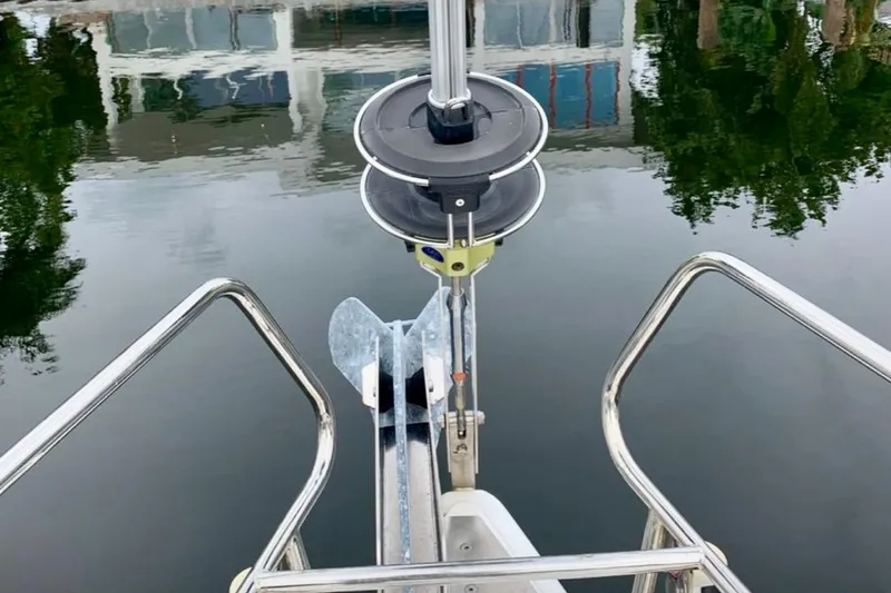 Slide: The Image of Bow view of 2009 Beneteau Oceanis 43 sailboat with anchor and calm water reflection. - 26