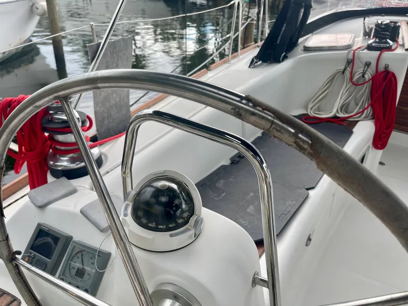 Slide: The Image of Beneteau Oceanis 43 cockpit, 2009 model, featuring compass and navigation instruments. - 36