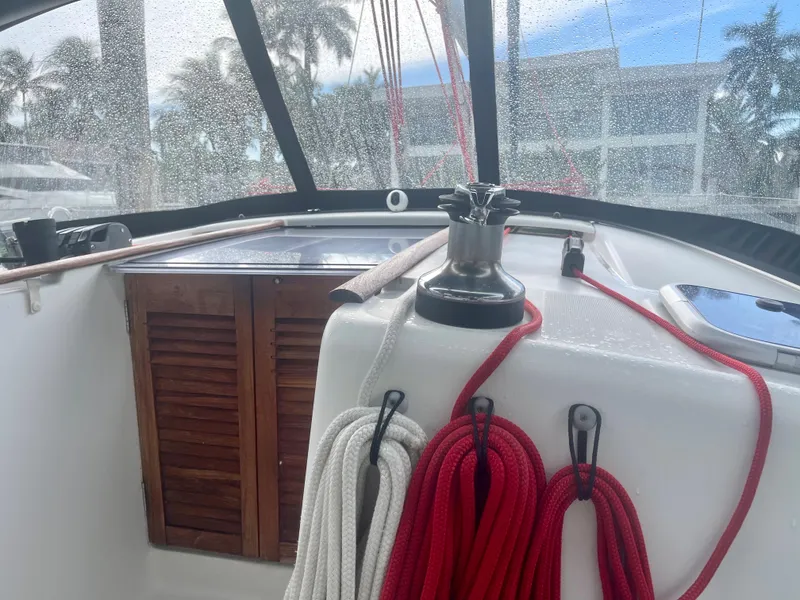 Slide: The Image of Beneteau Oceanis 43 cockpit, 2009 model, featuring ropes and wooden cabinet. - 40