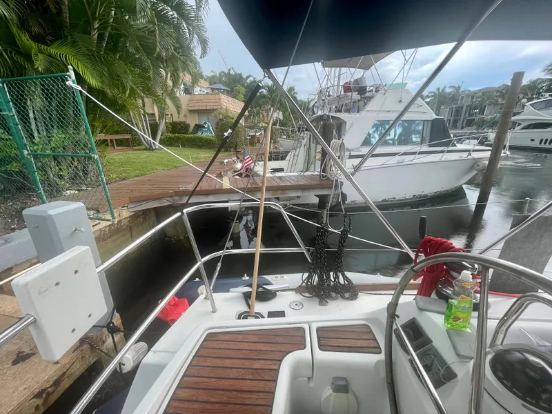 Slide: The Image of Beneteau Oceanis 43, 2009, docked with other boats in the background. - 42