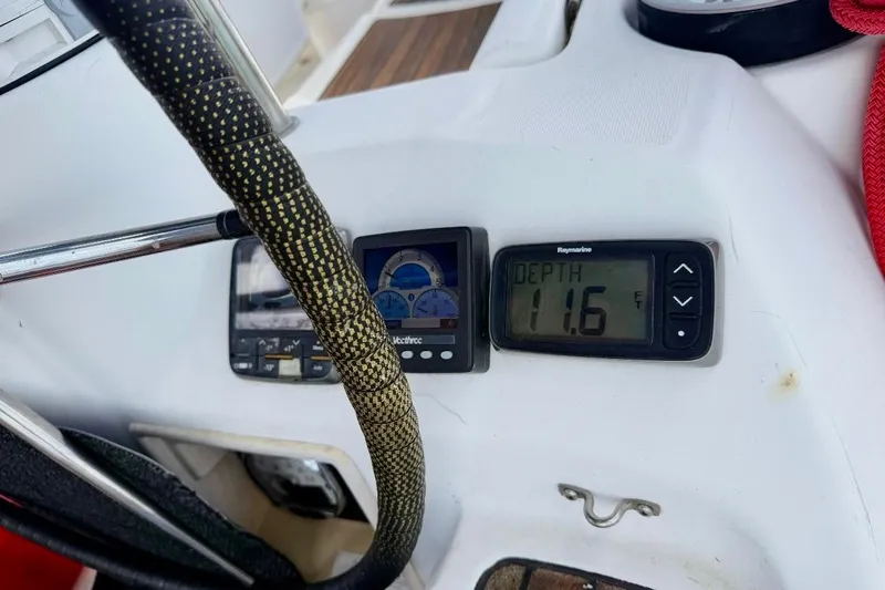 Slide: The Image of Beneteau Oceanis 43 cockpit instruments showing depth of 11.6 feet, 2009 model. - 49