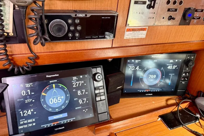 Slide: The Image of Navigation equipment on a 2009 Beneteau Oceanis 43 sailboat, featuring Raymarine displays. - 58