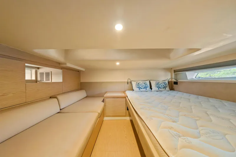 Slide: The Image of Luxurious interior cabin of 2024 Solaris Power 44 Open yacht, featuring cozy bed and seating. - 22