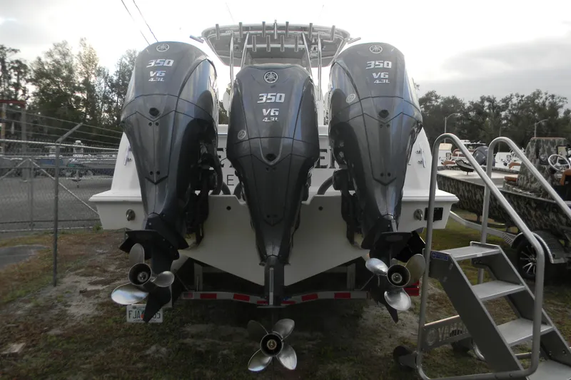 Slide: The Image of 2022 Contender 39 ST boat with triple Yamaha 350 V6 outboard engines. - 2
