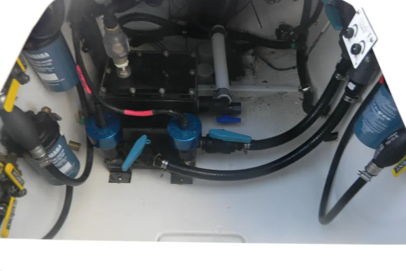 Slide: The Image of 2022 Contender 39 ST engine compartment with Yamaha filters and hoses. - 8