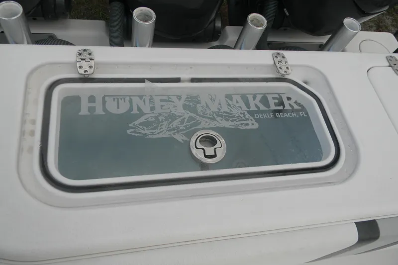 Slide: The Image of 2022 Contender 39 ST boat hatch with "HONEY MAKER" logo, Dekle Beach, FL. - 9