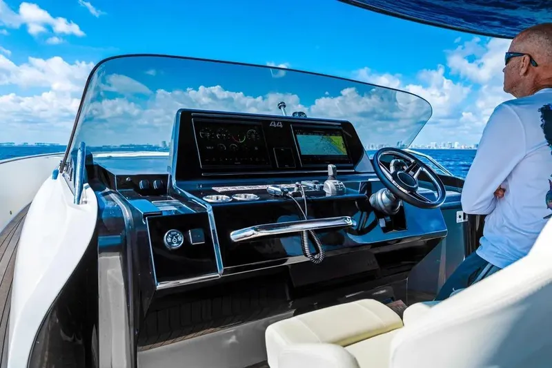 Slide: The Image of 2024 Solaris Power 44 Open yacht helm with modern controls and ocean view. - 11