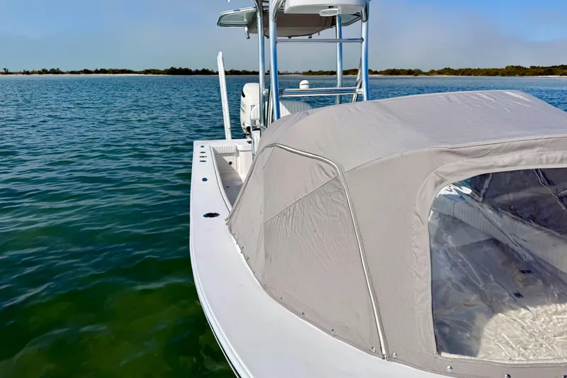 Slide: The Image of 2019 Aquasport 244 Bay boat with canopy on calm water. - 14
