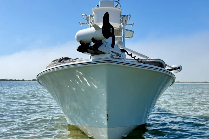 Slide: The Image of 2019 Aquasport 244 Bay boat on calm water, front view, clear sky background. - 8