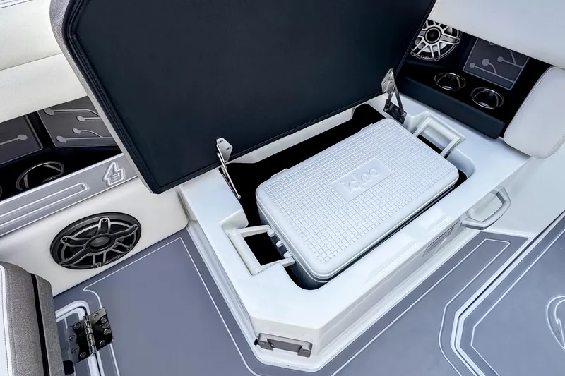 Slide: The Image of Ingenity EL 2026 boat interior with storage compartment and cooler. - 23