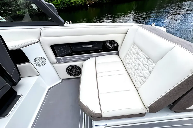 The Image of Luxurious seating on 2026 Ingenity EL boat with quilted upholstery and integrated speakers. - 5