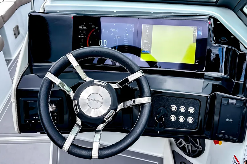 Slide: The Image of Steering wheel and dashboard of 2026 Ingenity EL boat with digital displays. - 7