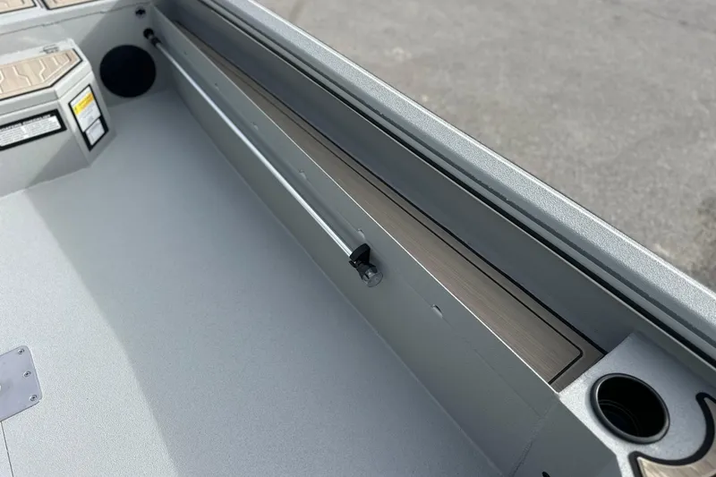 Slide: The Image of Interior view of 2026 Avid 18 Commander boat, featuring sleek design and cup holder. - 14