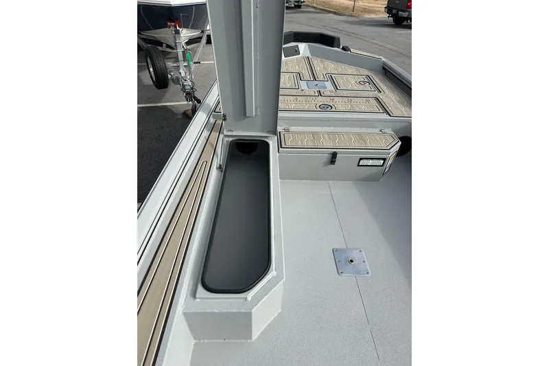 Slide: The Image of 2026 Avid 18 Commander boat interior with storage compartments and deck details. - 17