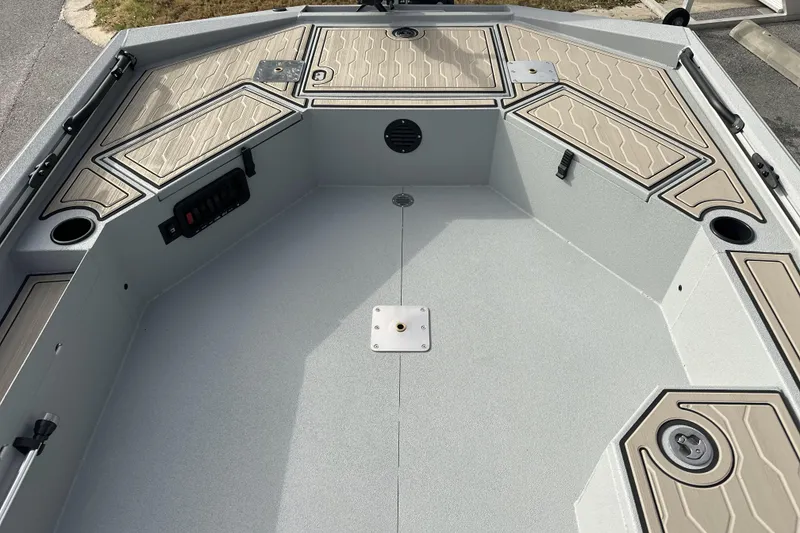 Slide: The Image of 2026 Avid 18 Commander boat interior with storage compartments and cup holders. - 22
