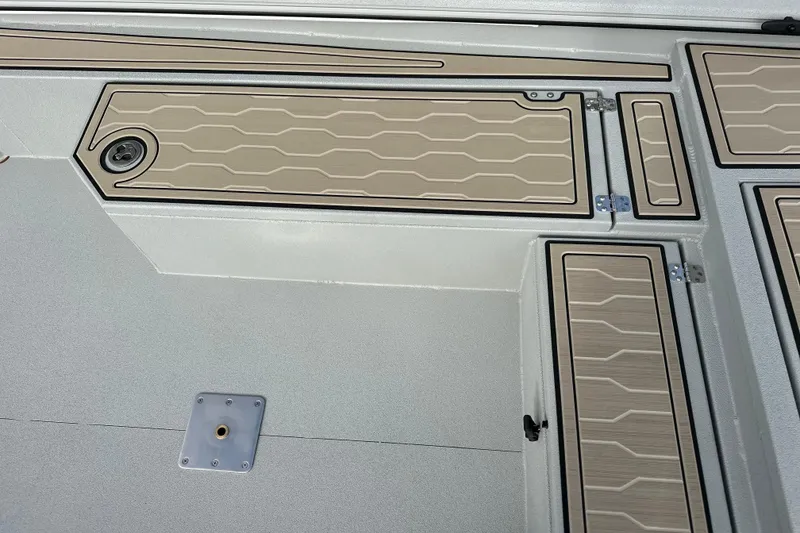 Slide: The Image of Interior view of 2026 Avid 18 Commander boat with sleek storage compartments. - 23