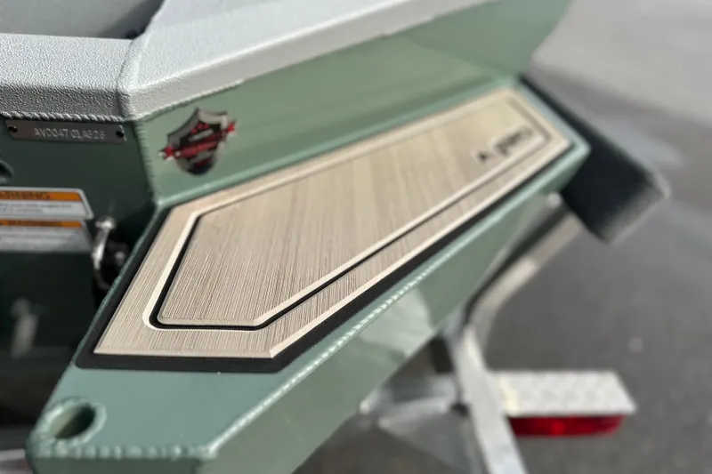 Slide: The Image of 2026 Avid 18 Commander boat detail with sleek design and textured surface. - 6